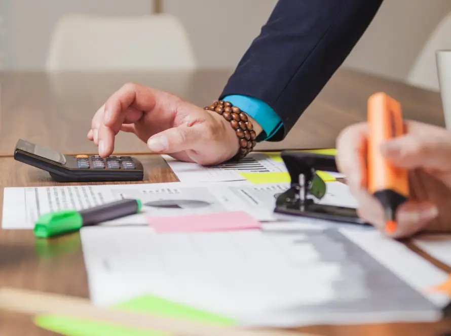 Tax advisor reviewing financial documents and guiding a client on compliance and property tax.