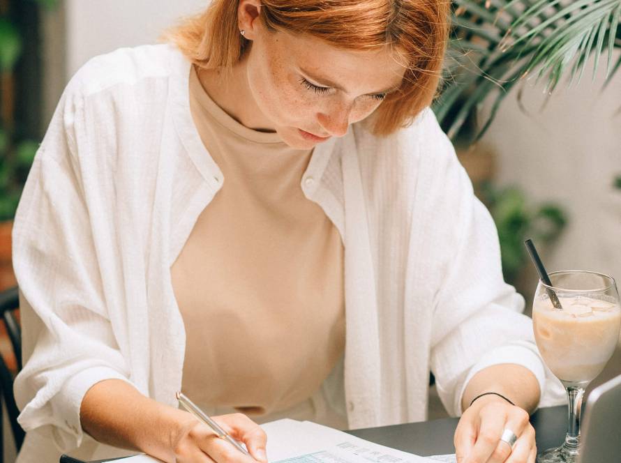 Auditor reviewing financial reports and assessing risk factors during an internal audit.