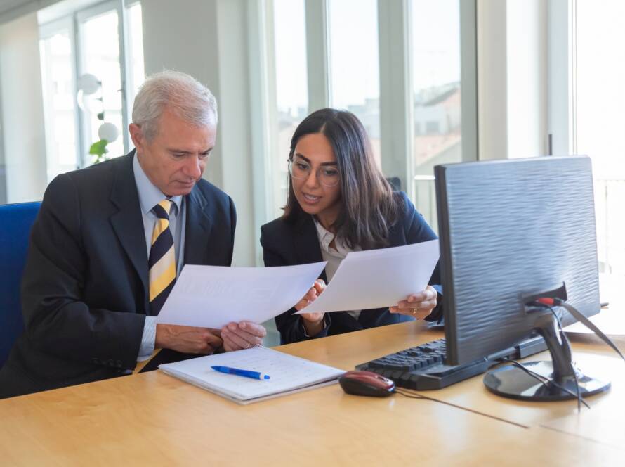 Business consultants reviewing financial documents together in an office
