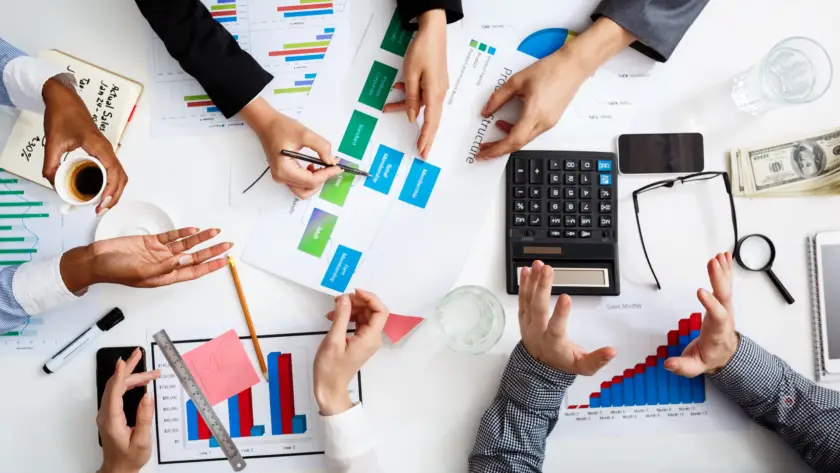 Audit partners from Jamal A. Nasir firm reviewing financial documents and structure drafts